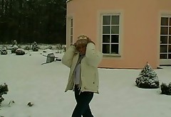 Crazy blond whore strokes her snatch with glove covered hand in snowy weather