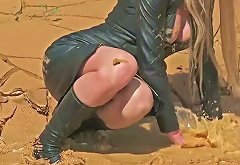 Leather Girl Playing in Mud